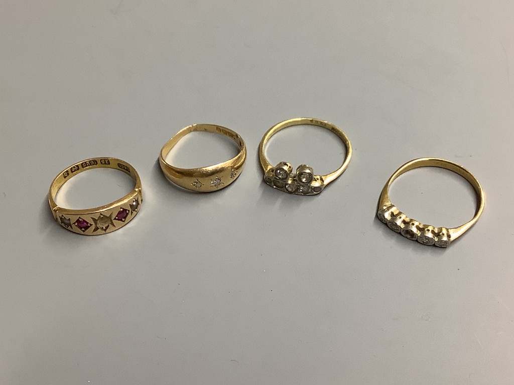 Three assorted 18ct and diamond set dress rings, gross 7.2 grams